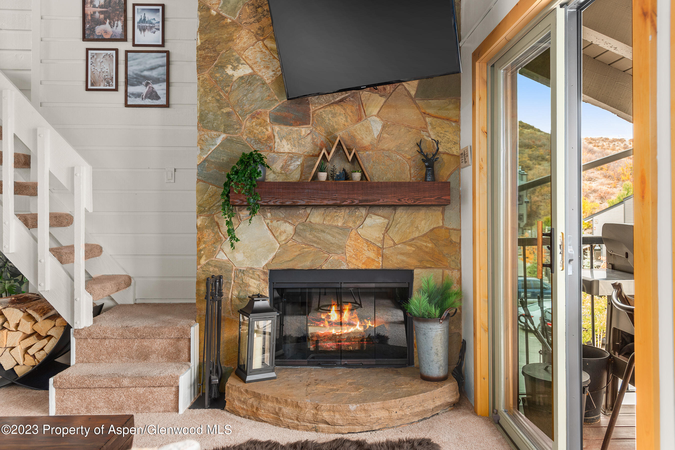 55 Upper Woodbridge Road, Unit G3 Snowmass Village, CO 81615 - Photo 6 of 44 a living room with a fireplace