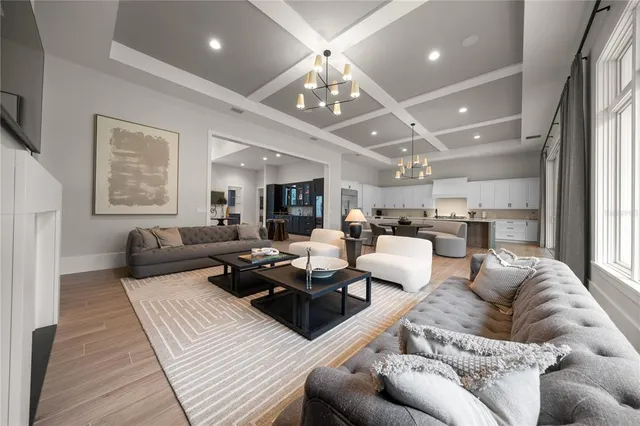 a bedroom with two beds and a painting on the wall