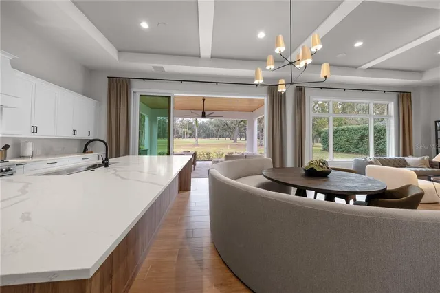 a bedroom with furniture and large windows