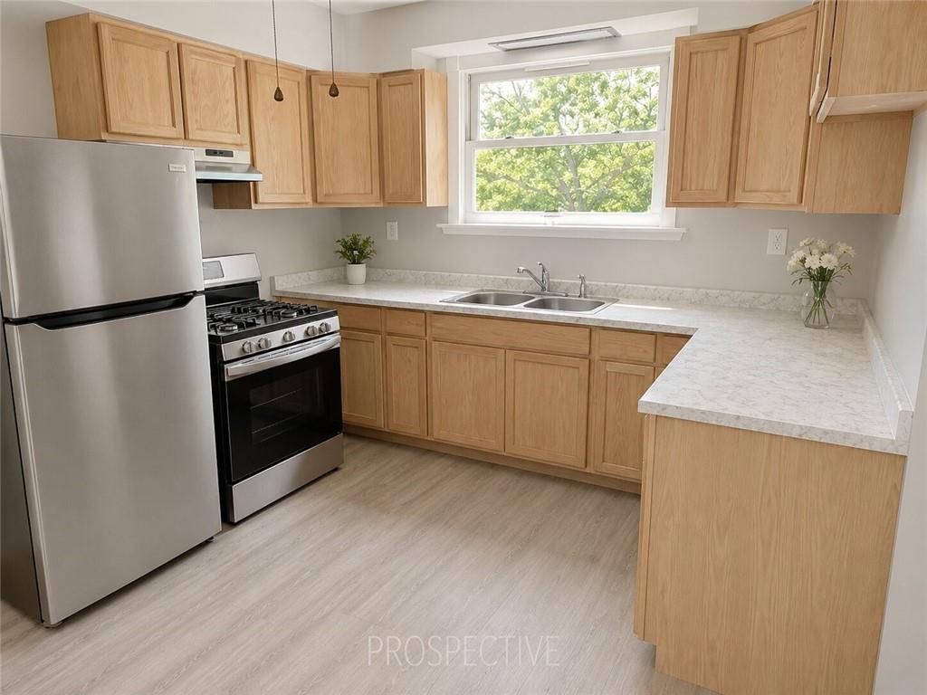 3079 Mt Troy Road Pittsburgh, PA 15212 - Photo 9 of 30 a kitchen with stainless steel appliances granite countertop a refrigerator sink and stove