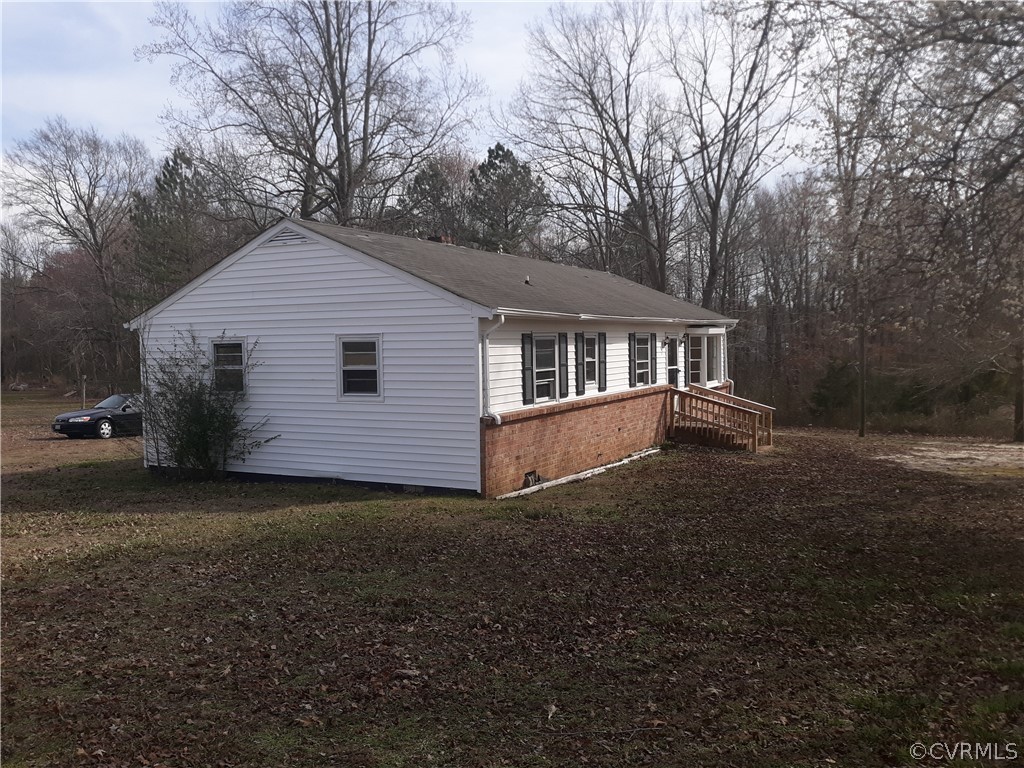 244 Bradley Farm Road Newtown, VA 23126 - Photo 8 of 14 a view of a house with a yard