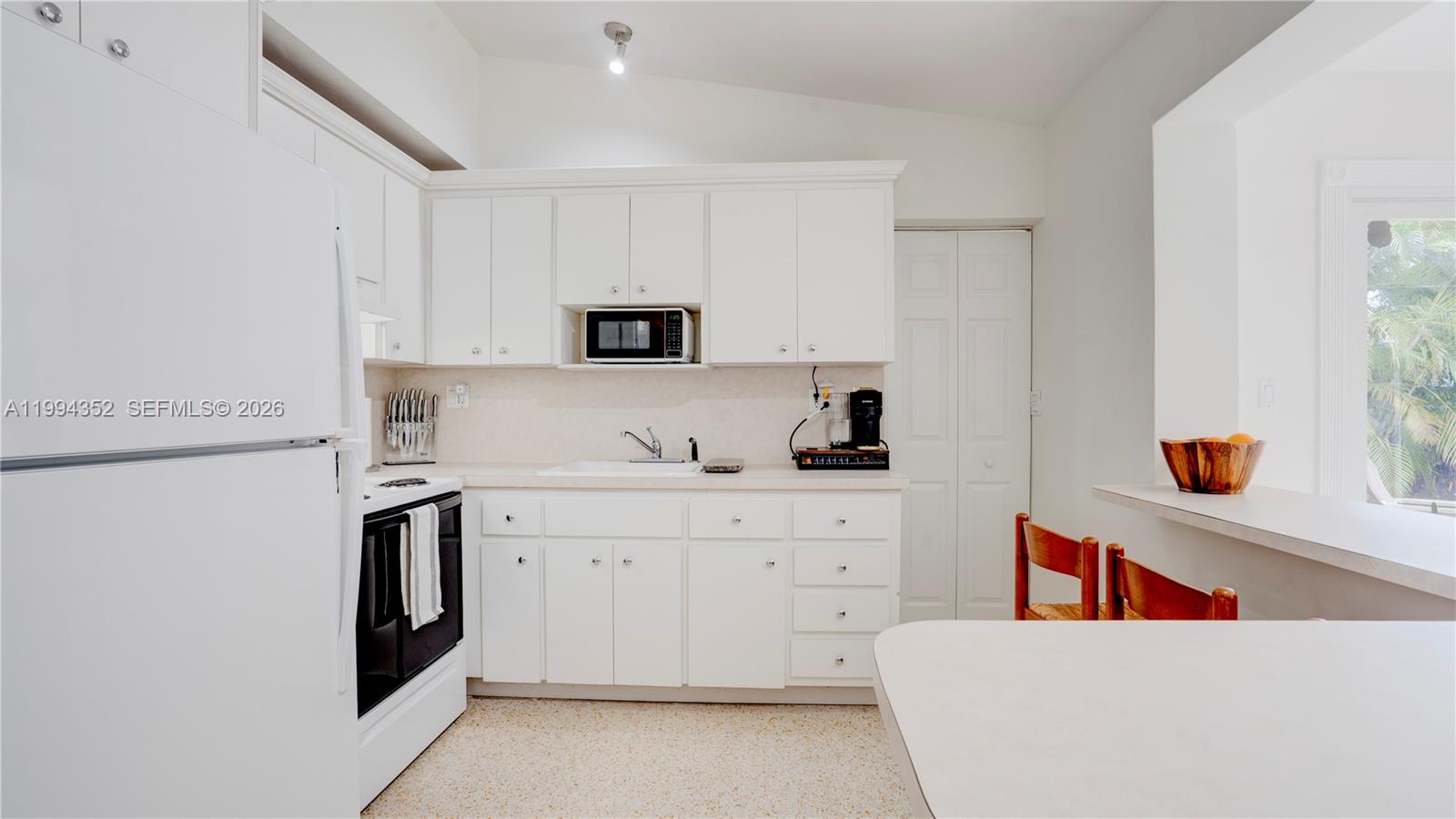 2905 Southwest 93rd Court Miami, FL 33165 - Photo 15 of 46 a kitchen with stainless steel appliances a sink a stove a refrigerator a white counter top and cabinets