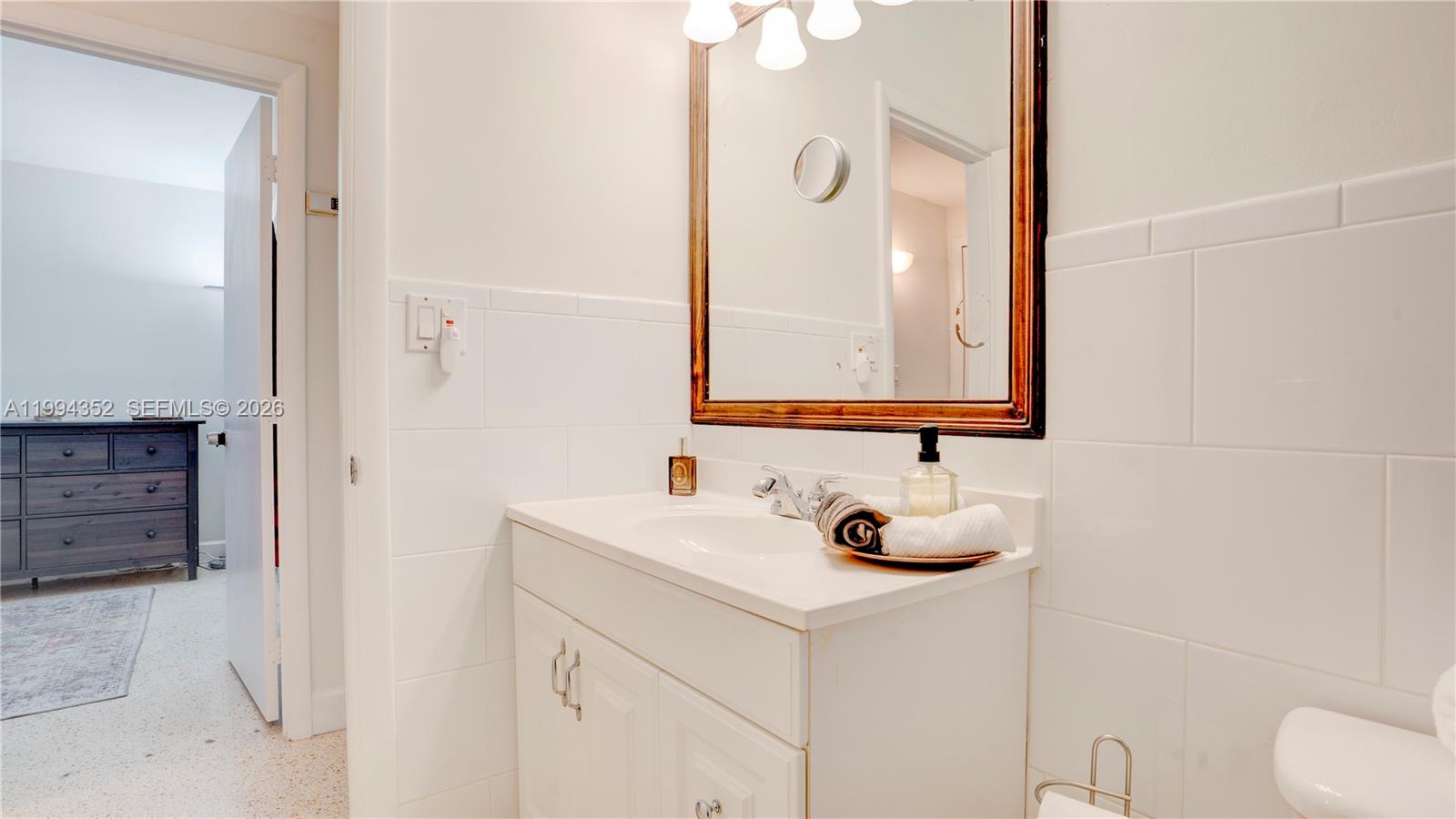 2905 Southwest 93rd Court Miami, FL 33165 - Photo 33 of 46 a bathroom with a sink and a mirror
