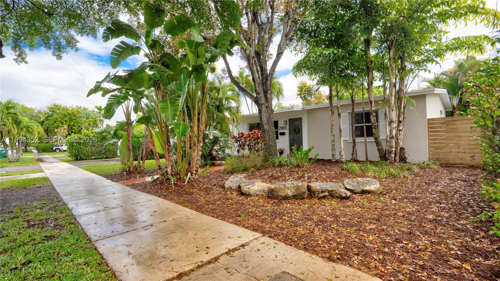 2905 Southwest 93rd Court Miami, FL 33165 - Photo 6 of 46 a backyard of a house with garden and patio