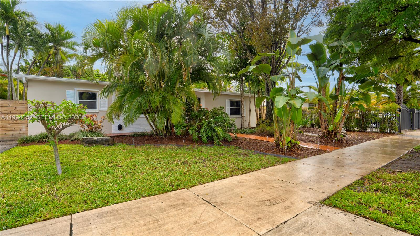 2905 Southwest 93rd Court Miami, FL 33165 - Photo 8 of 46 a backyard of a house with seating space