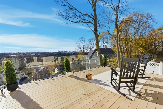 a view of a backyard with sitting area