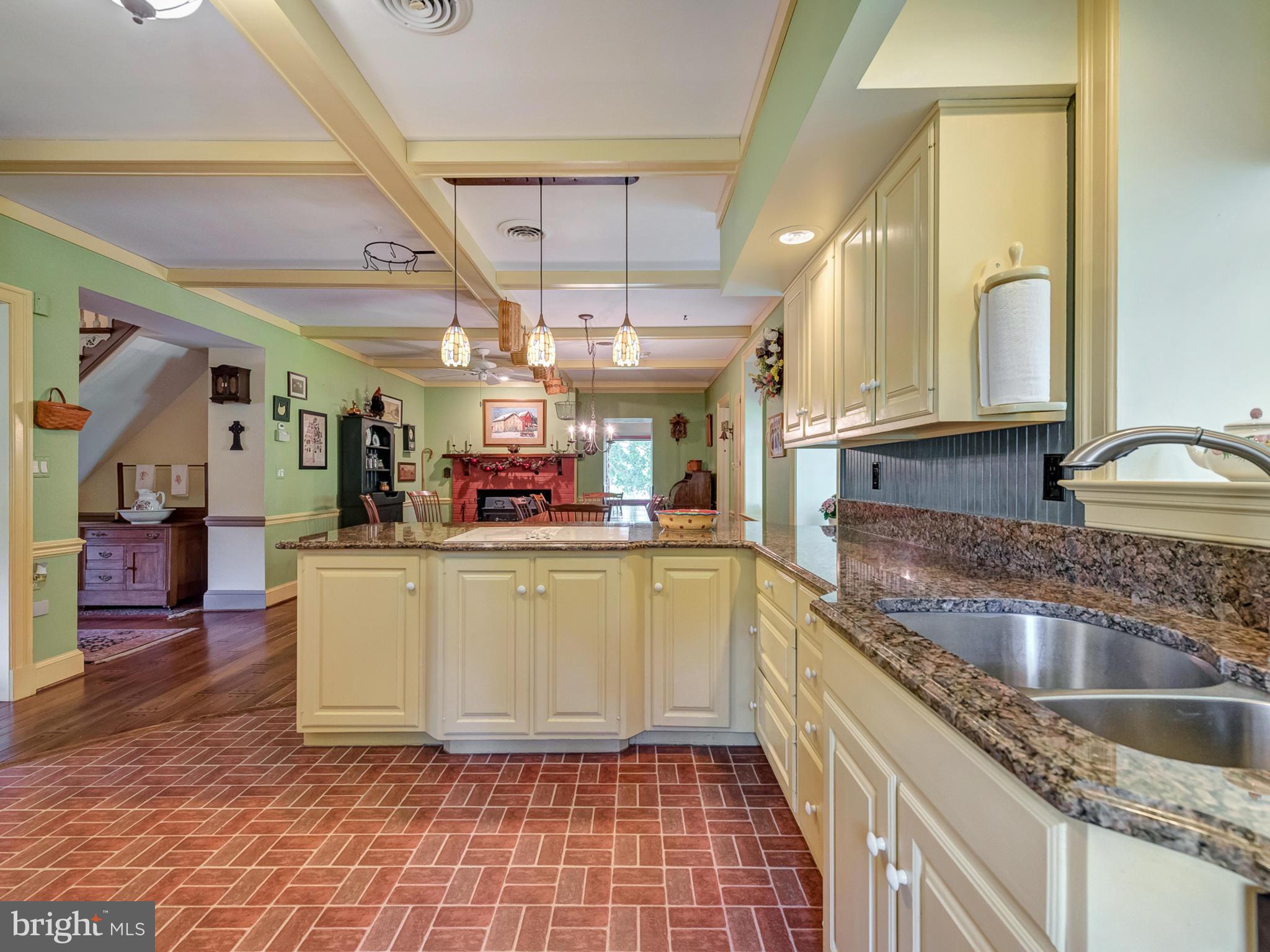 8707 Mapleville Road Boonsboro, MD 21713 - Photo 13 of 30 Lots of cabinet space in this bright open kitchen.