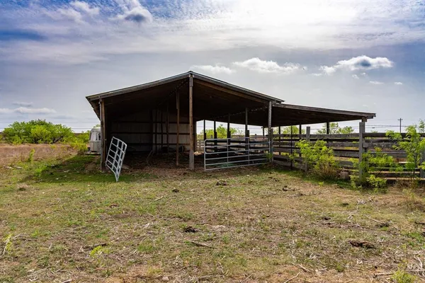 a view of house with backyard and deck