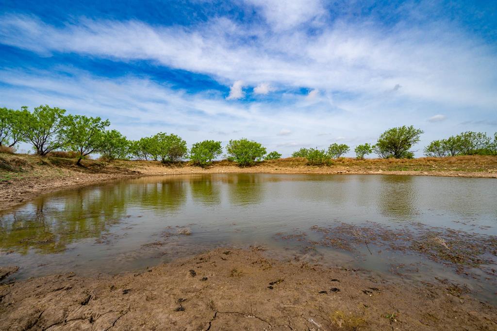 Tbd Rockdale Road Lueders, TX 79533 - Photo 8 of 40 a view of a lake with houses in the background