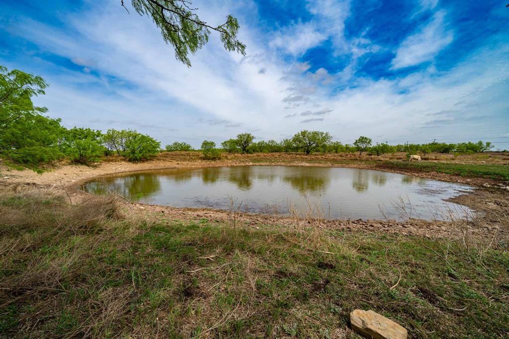 Tbd Rockdale Road Lueders, TX 79533 - Photo 9 of 40 a view of a lake with houses in the back