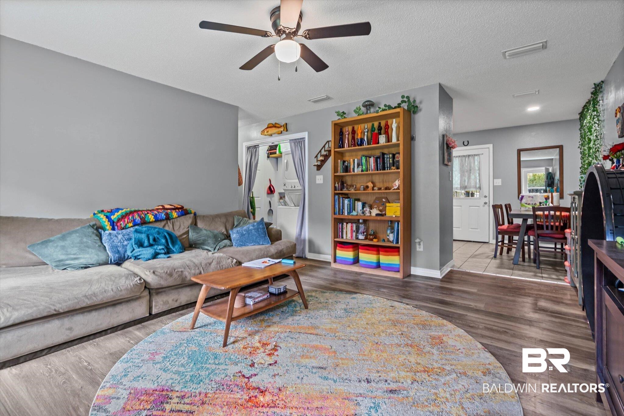 14165 River Oaks Road, Unit A & B Coden, AL 36523 - Photo 13 of 35 Living room with wood finished floors, a textured ceiling, and ceiling fan