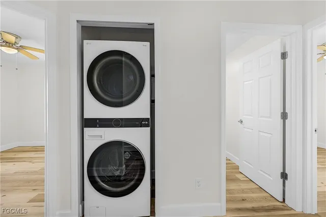 a view of a hallway with washer and dryer