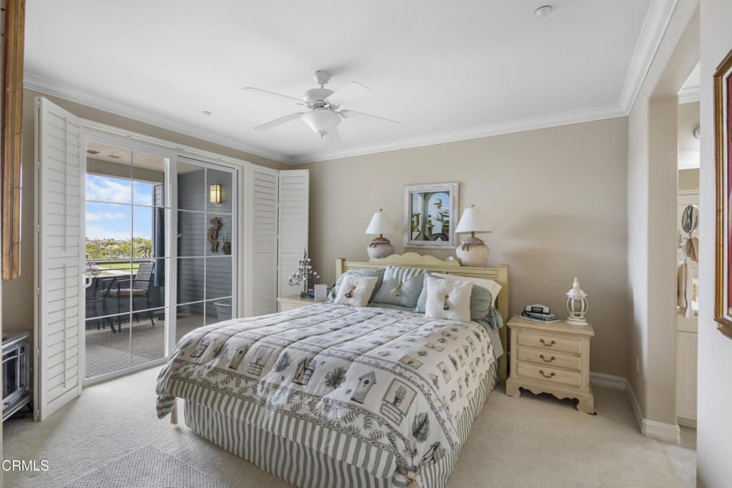 1547 Windshore Way Oxnard, CA 93035 - Photo 18 of 33 a bedroom with a large bed and a chandelier