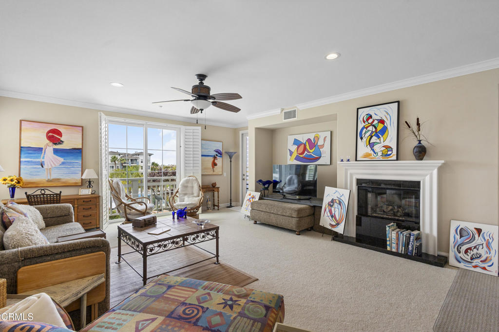 1547 Windshore Way Oxnard, CA 93035 - Photo 3 of 33 a living room with furniture and a fireplace