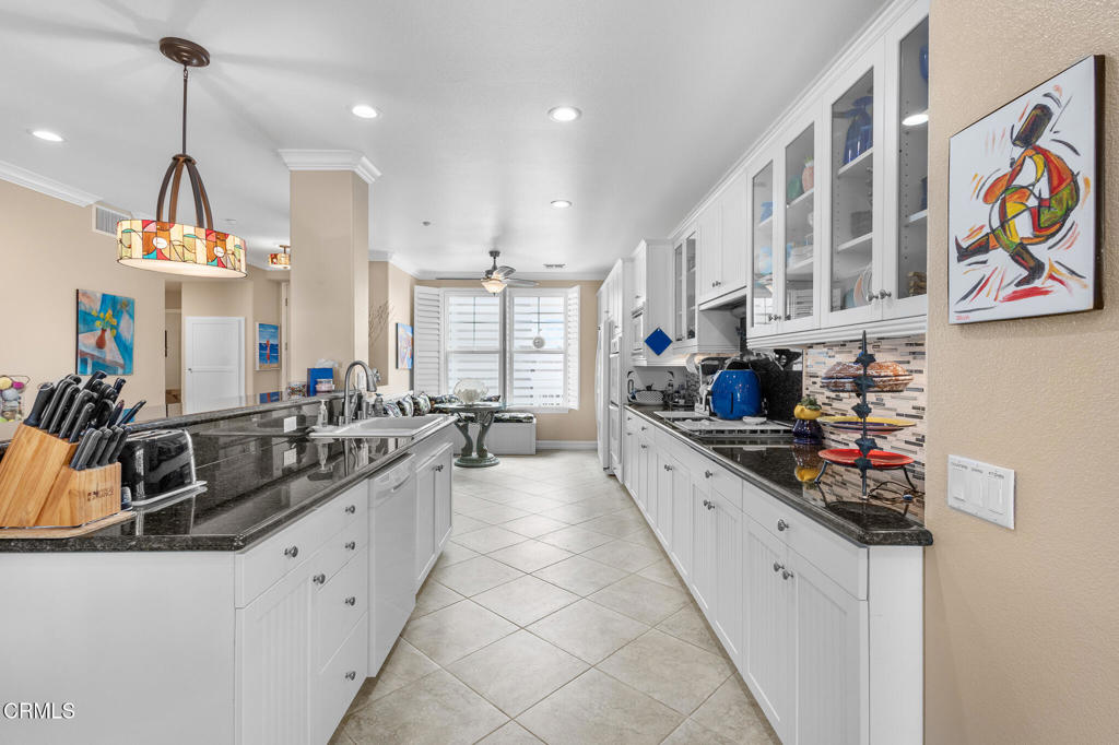 1547 Windshore Way Oxnard, CA 93035 - Photo 9 of 33 a kitchen with stainless steel appliances a sink stove and cabinets