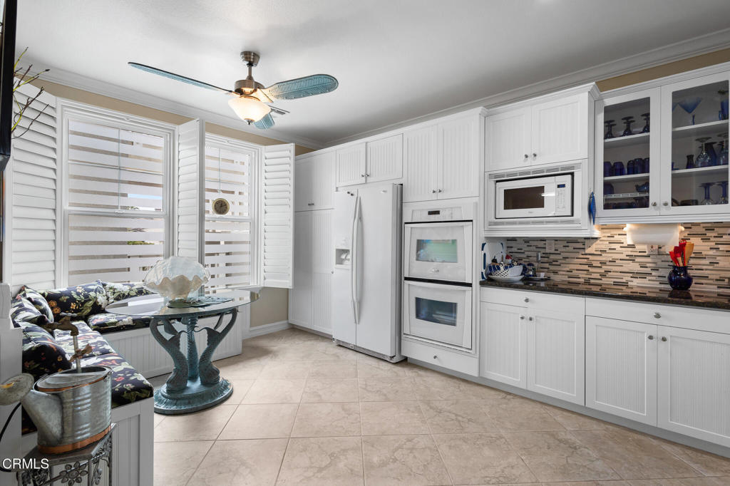 1547 Windshore Way Oxnard, CA 93035 - Photo 10 of 33 a kitchen with stainless steel appliances granite countertop a sink a stove and a refrigerator