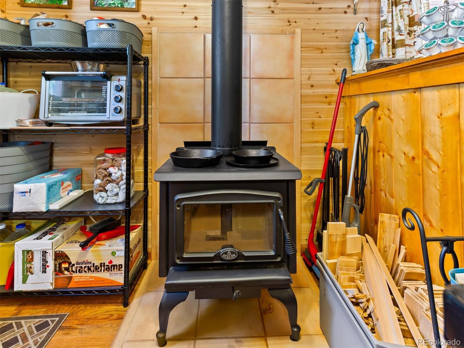 P69 P 69 Bailey, CO 80421 - Photo 13 of 22 a living room with a fireplace and a wooden floor