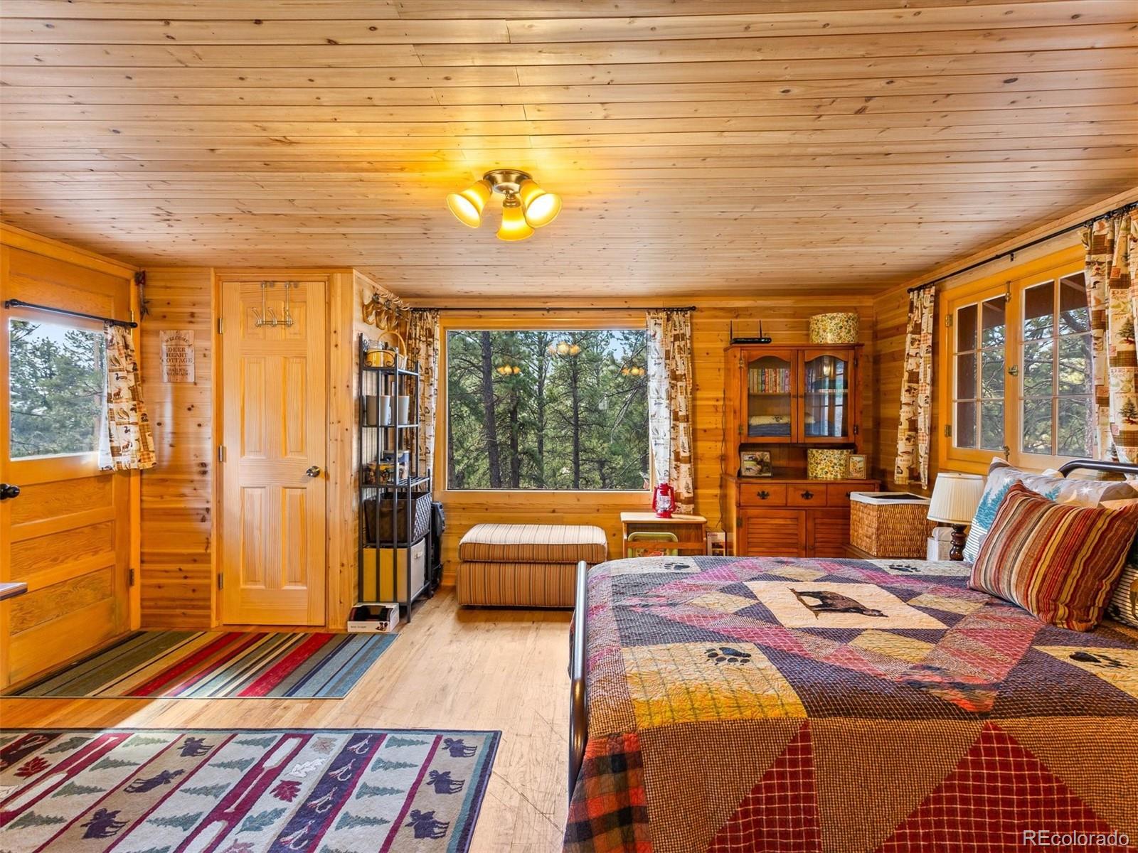 P69 P 69 Bailey, CO 80421 - Photo 9 of 22 a bedroom with furniture and a large window