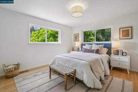 a bed room with a bed and a window