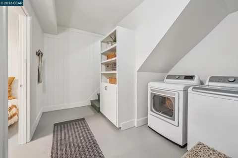 a bedroom with a bed and a desk