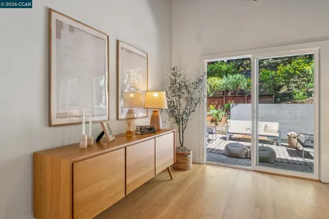 a view of backyard of house with seating space