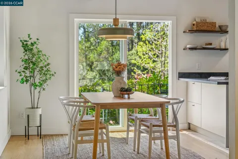 a dining room with furniture and window