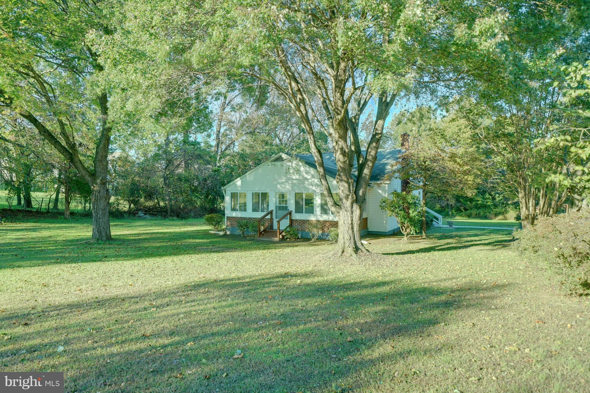 10682 Scaggsville Road Laurel, MD 20723 - Photo 3 of 49 Flat grassy yard with mature trees and shrubs