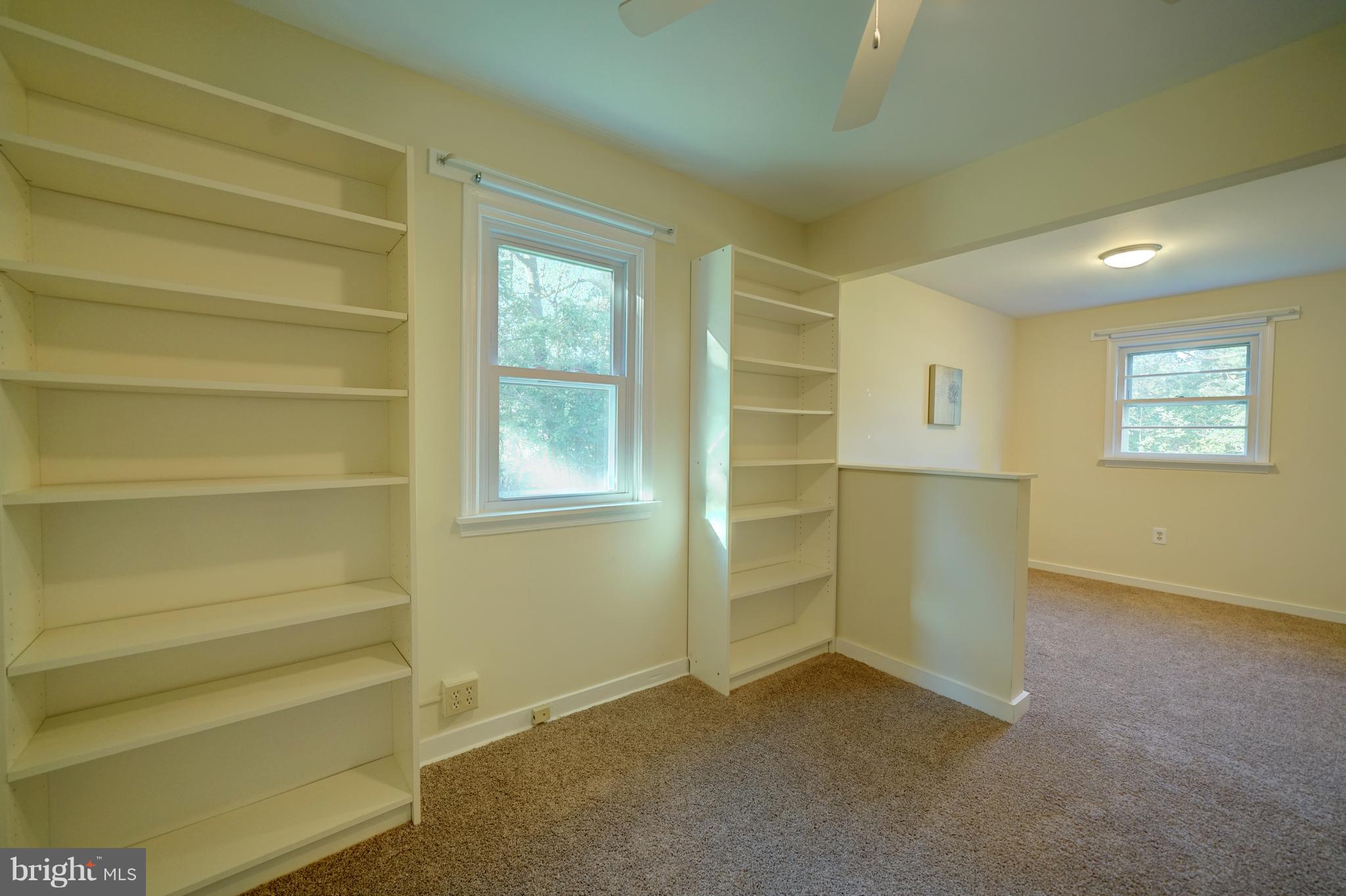 10682 Scaggsville Road Laurel, MD 20723 - Photo 27 of 49 Bedroom w/sitting area and bookcases
