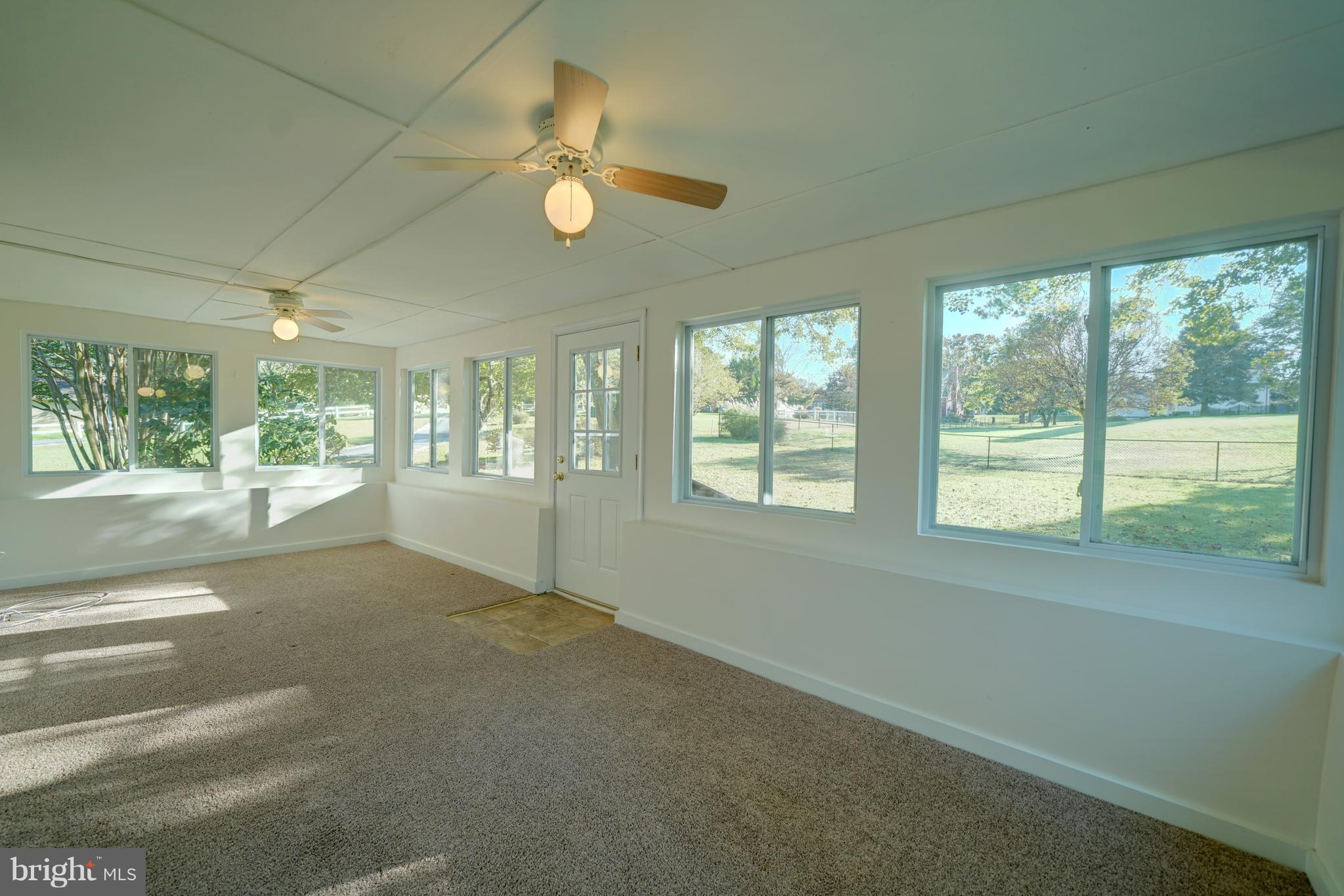 10682 Scaggsville Road Laurel, MD 20723 - Photo 9 of 49 3 sided windows in the sunroom