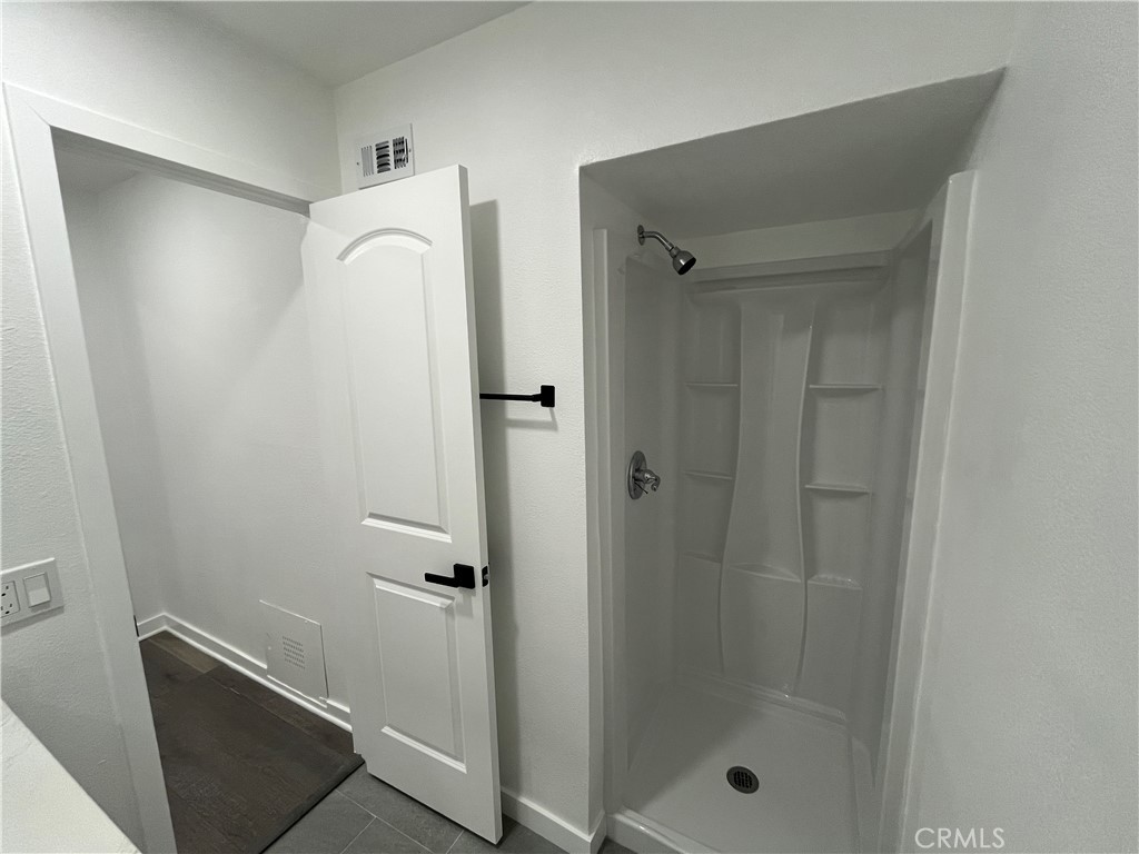 9155 Pacific Avenue, Unit 219 Anaheim, CA 92804 - Photo 20 of 26 a bathroom with a shower