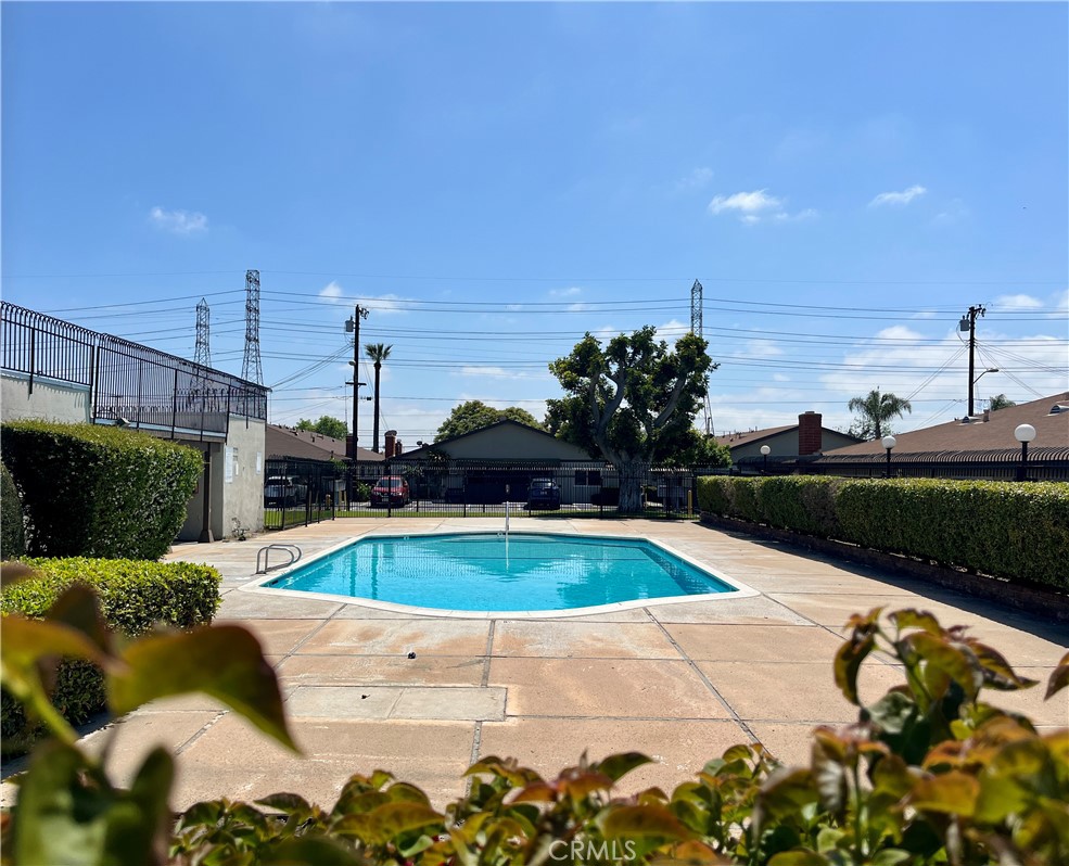 9155 Pacific Avenue, Unit 219 Anaheim, CA 92804 - Photo 26 of 26 a view of a swimming pool with a patio