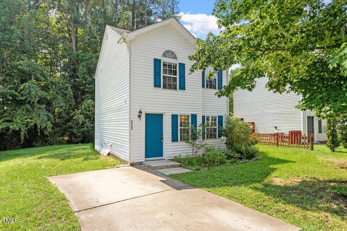 2733 Midway Park Court Raleigh, NC 27610 - Photo 1 of 30 a front view of a house with a yard and garage