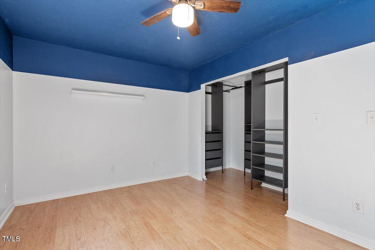 2733 Midway Park Court Raleigh, NC 27610 - Photo 19 of 30 a view of walk in closet with empty racks