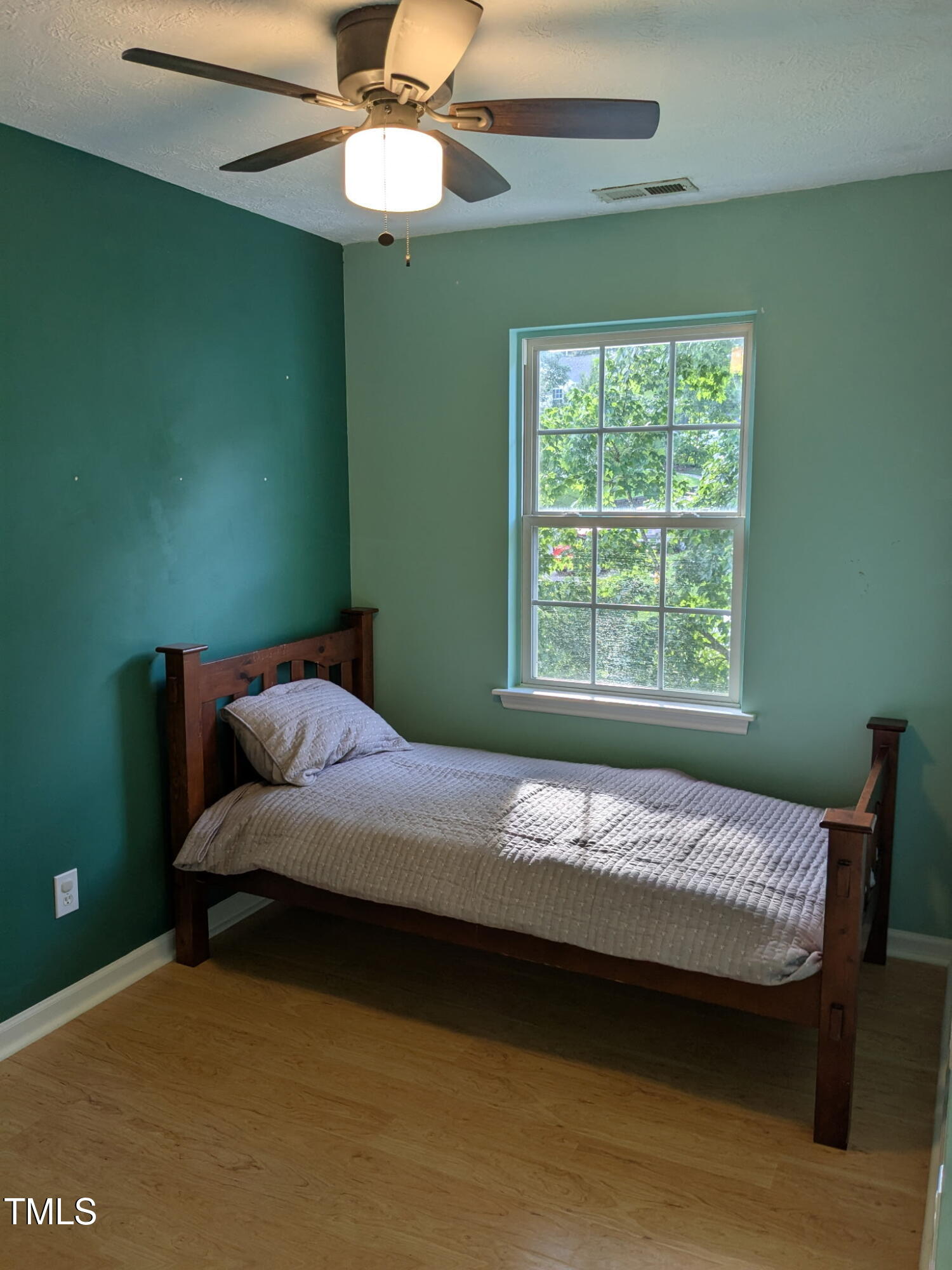 2733 Midway Park Court Raleigh, NC 27610 - Photo 22 of 30 a bedroom with a bed and a window