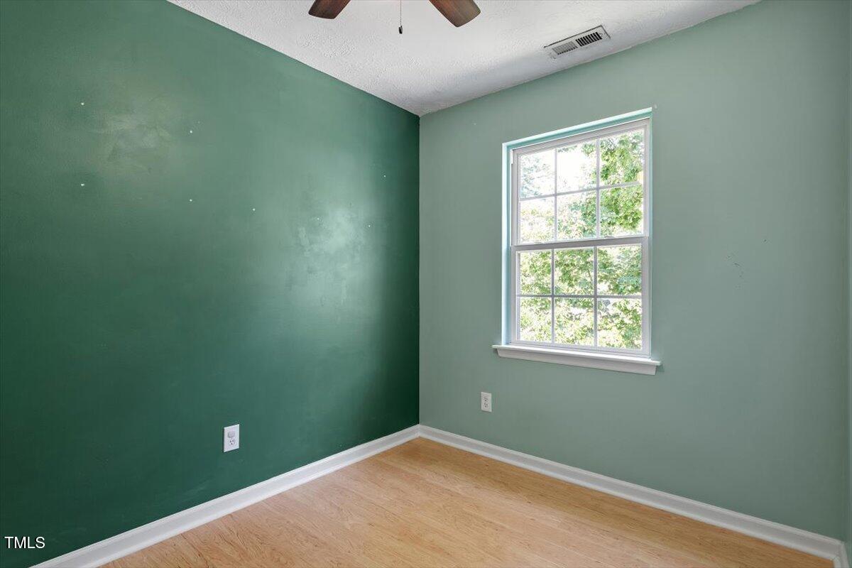 2733 Midway Park Court Raleigh, NC 27610 - Photo 23 of 30 an empty room with windows