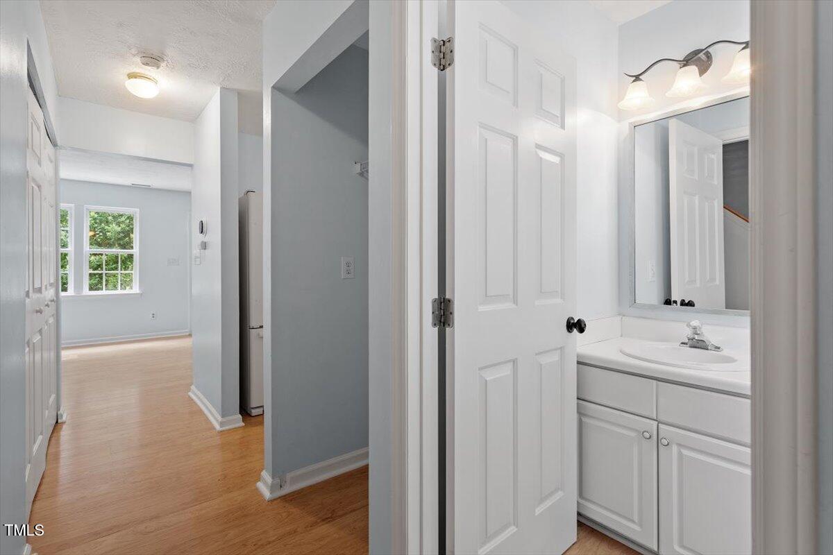 2733 Midway Park Court Raleigh, NC 27610 - Photo 5 of 30 a bathroom with a double vanity sink and mirror