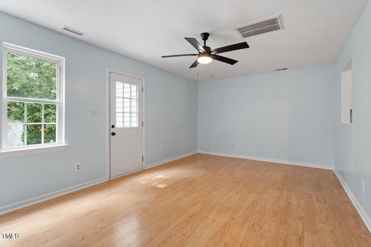 2733 Midway Park Court Raleigh, NC 27610 - Photo 6 of 30 a view of an empty room with a window