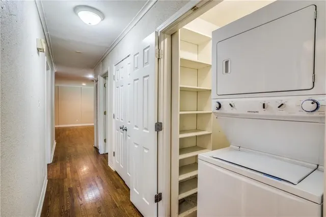 a view of washer and dryer with wooden floor
