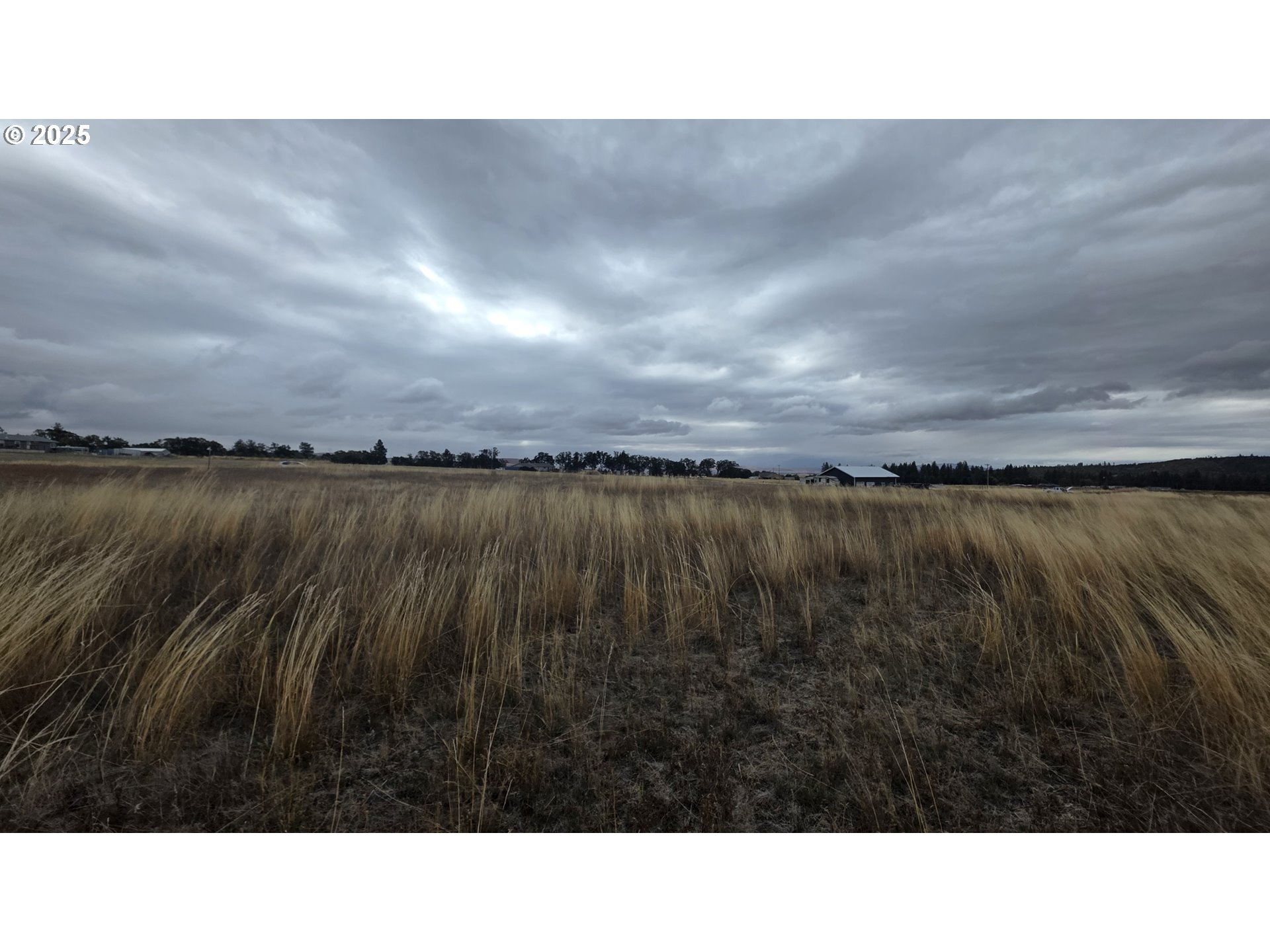Sara View Drive, Unit 2 Goldendale, WA 98620 - Photo 5 of 10 a open area with lake view and mountain in the back