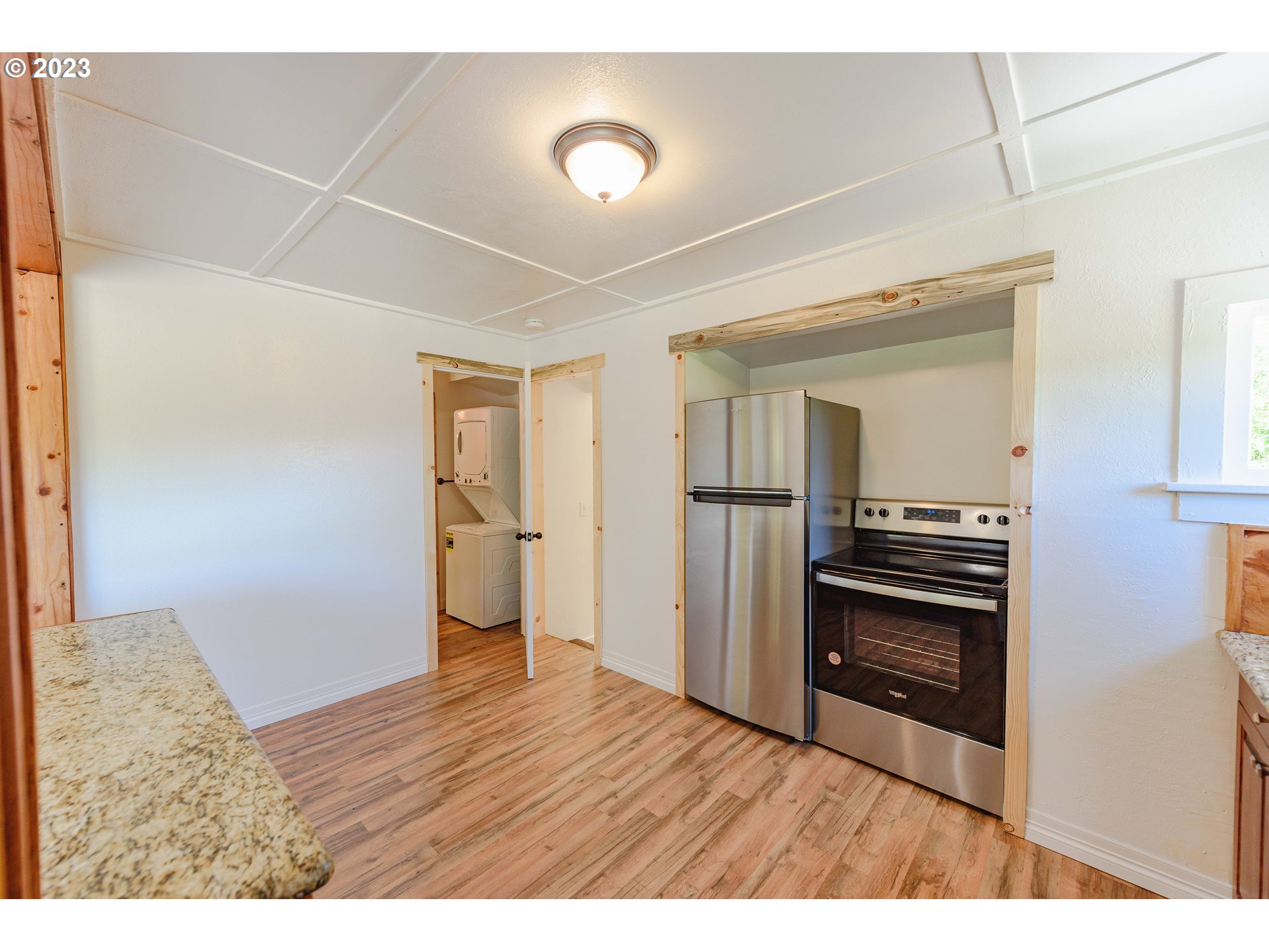 54156 Old Broadbent Road Myrtle Point, OR 97458 - Photo 28 of 48 a room with wooden floor and electronic appliances