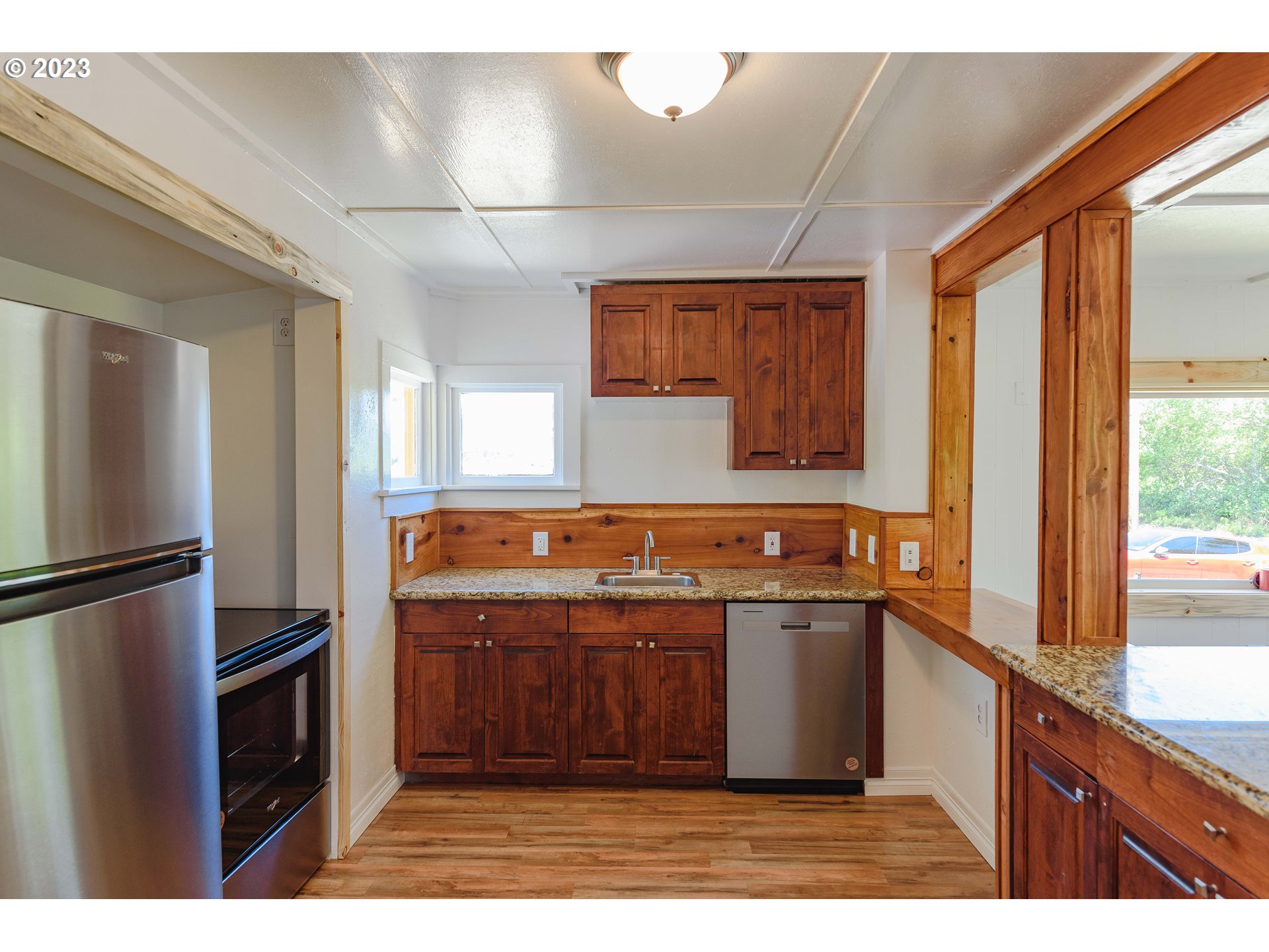 54156 Old Broadbent Road Myrtle Point, OR 97458 - Photo 30 of 48 a kitchen with stainless steel appliances granite countertop a stove a sink and a refrigerator