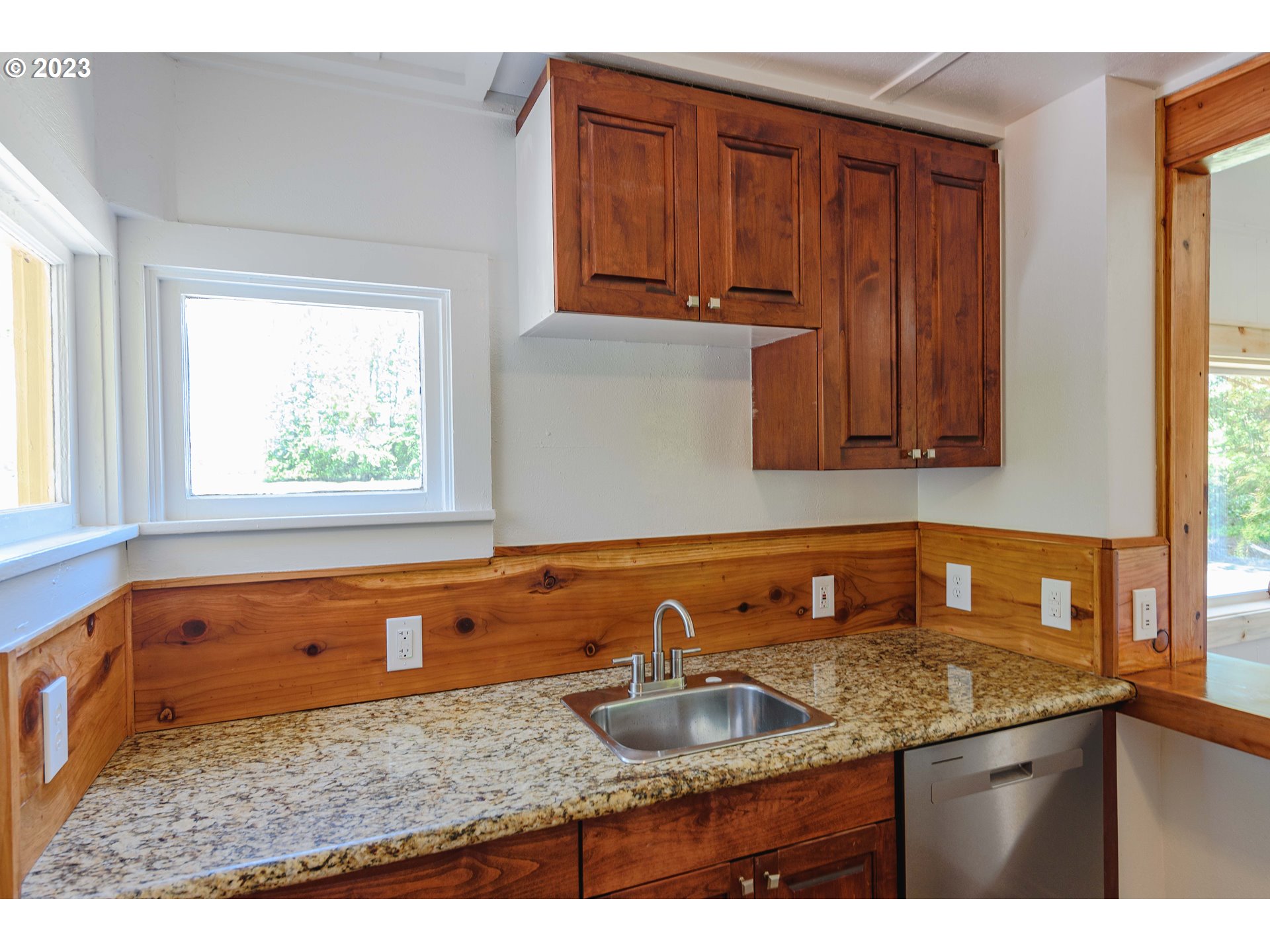 54156 Old Broadbent Road Myrtle Point, OR 97458 - Photo 32 of 48 a kitchen with sink cabinets and window
