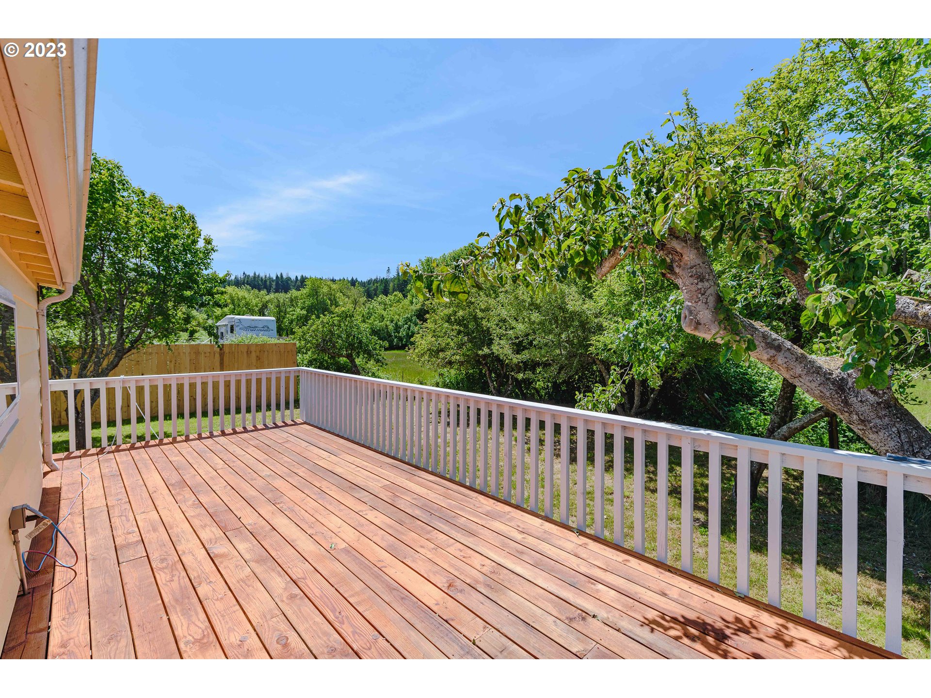 54156 Old Broadbent Road Myrtle Point, OR 97458 - Photo 33 of 48 a view of balcony with wooden floor and fence