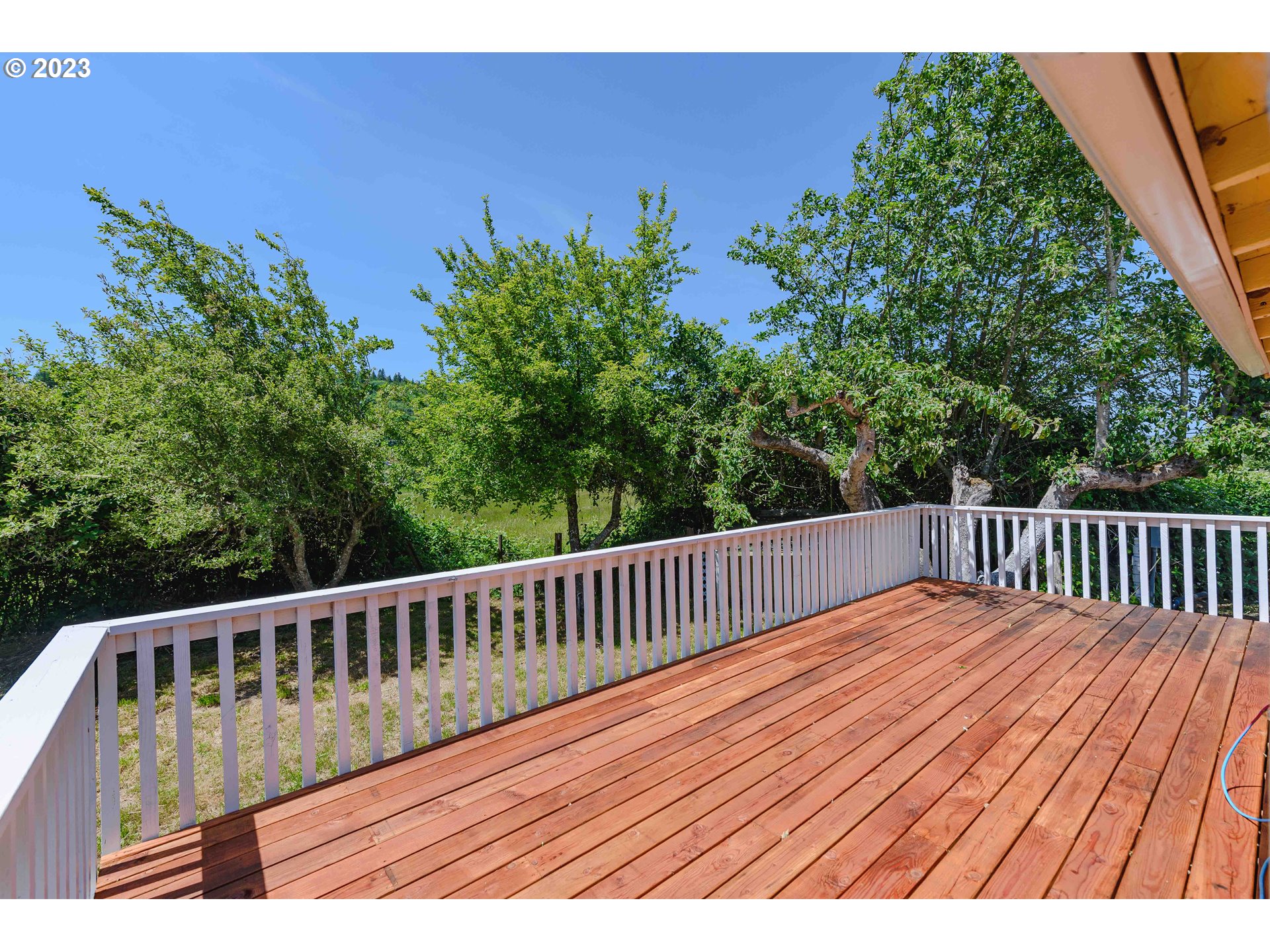54156 Old Broadbent Road Myrtle Point, OR 97458 - Photo 36 of 48 a view of balcony with wooden floor and fence