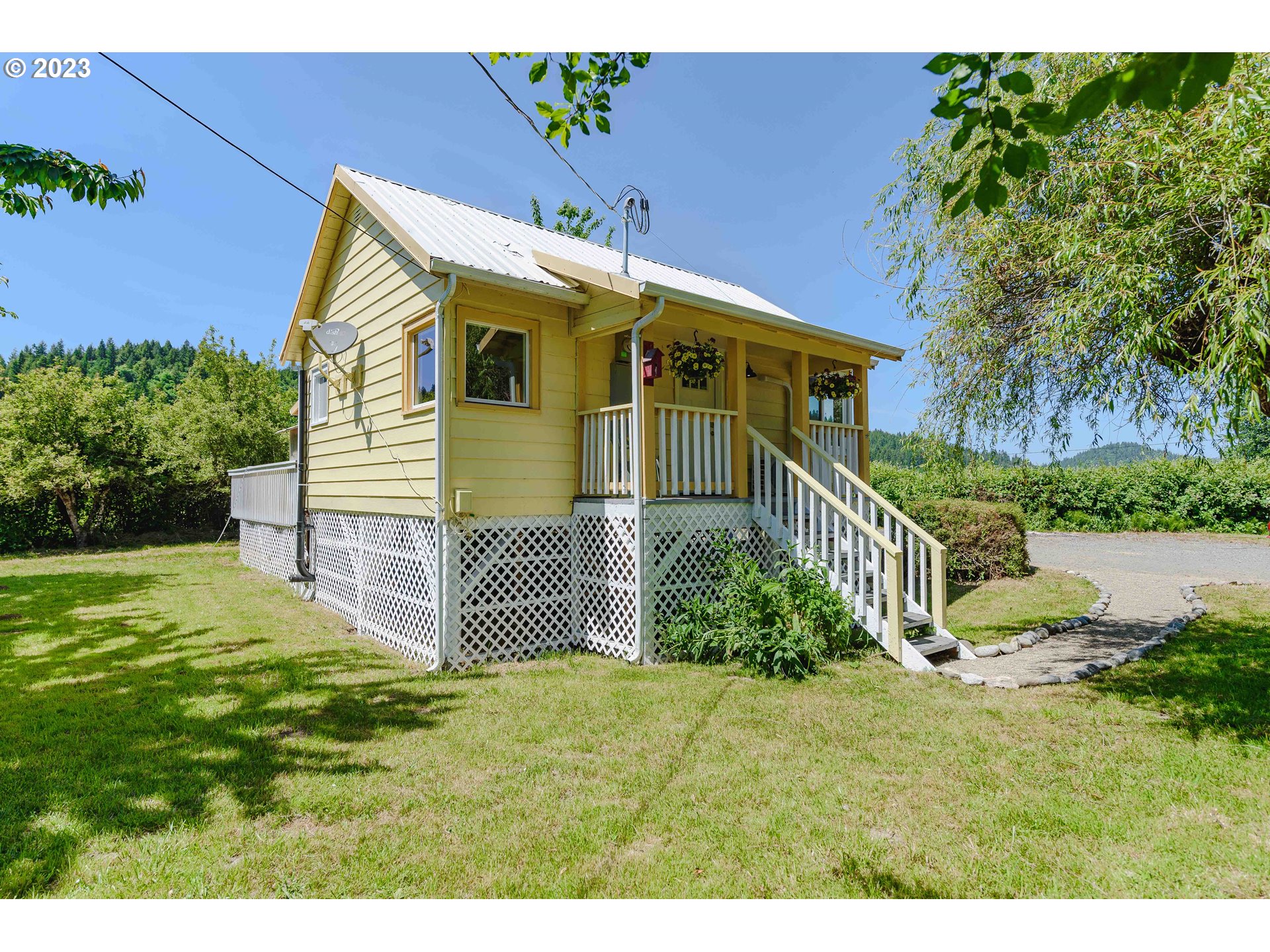 54156 Old Broadbent Road Myrtle Point, OR 97458 - Photo 38 of 48 a front view of a house with a yard