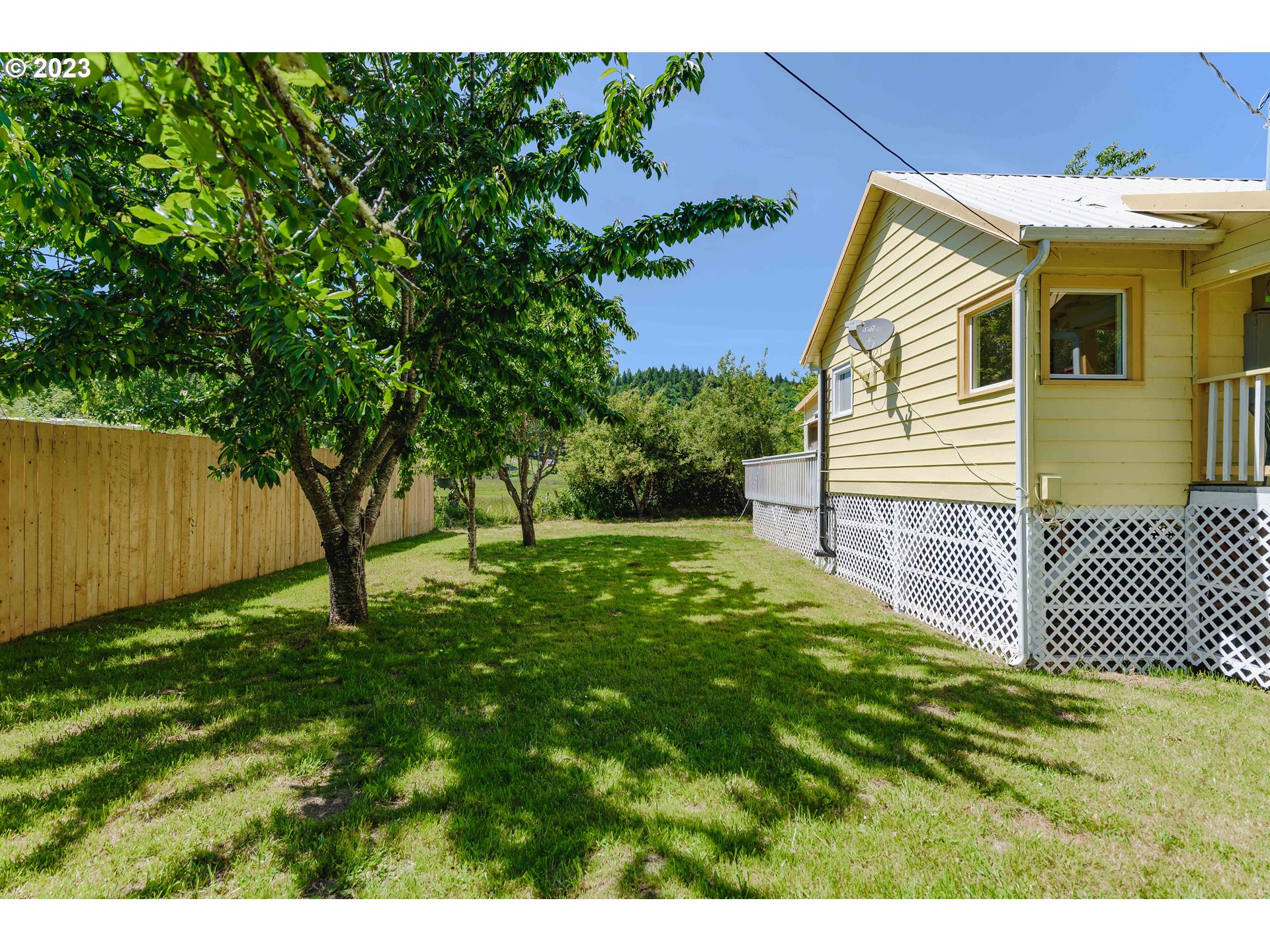 54156 Old Broadbent Road Myrtle Point, OR 97458 - Photo 39 of 48 a view of a house with a backyard