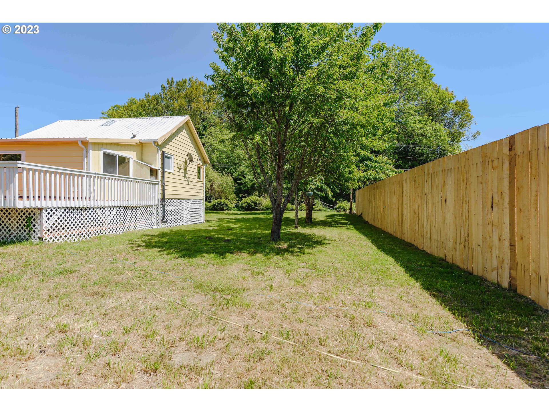 54156 Old Broadbent Road Myrtle Point, OR 97458 - Photo 43 of 48 a view of a backyard with a garden