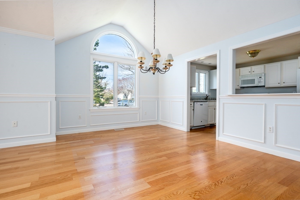 15 Beacon Court, Unit 229 Mashpee, MA 02649 - Photo 7 of 33 a view of a room with wooden floor electronic appliances and windows