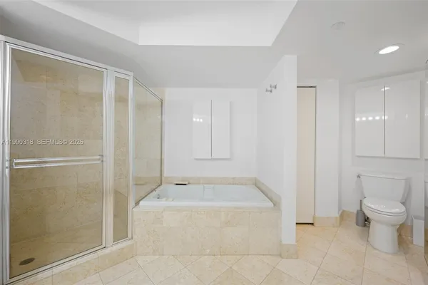 a bathroom with a bathtub and a toilet