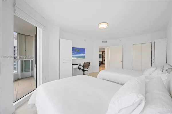 a bedroom with a bed and a cabinets